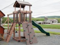 Busy Base Camp Play Set in Woodgrain Brown Vinyl with Green Slides and Swings